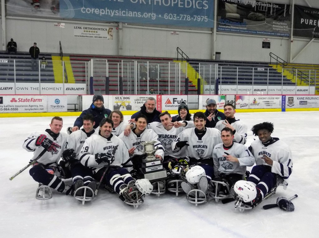 Northeast Passage Wildcats with A Conference Trophy