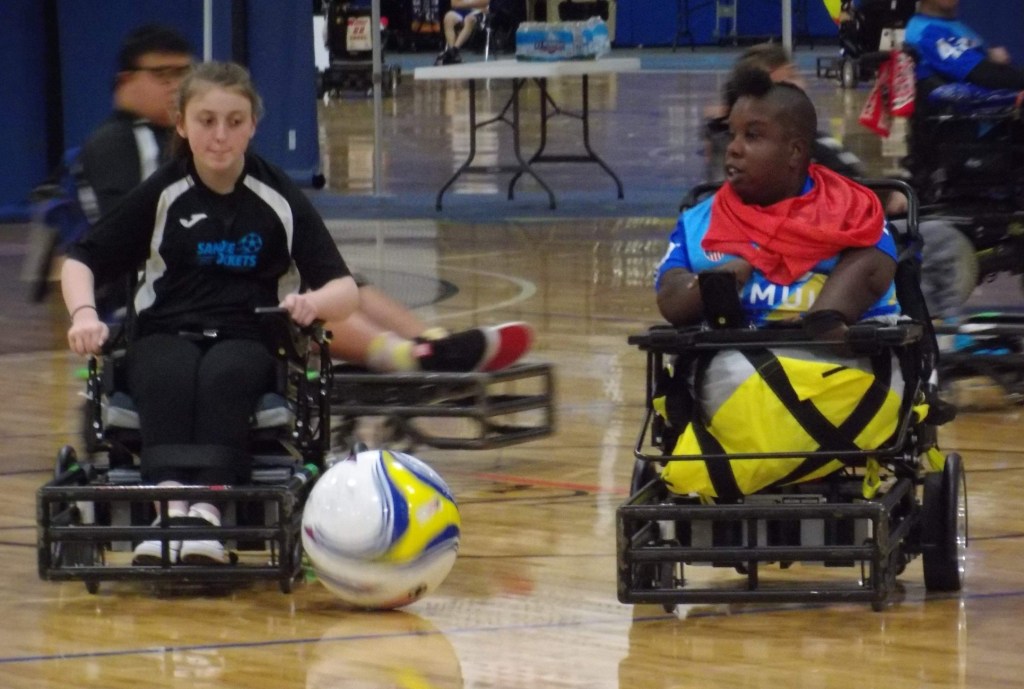 Two battling power soccer players in lower conferences